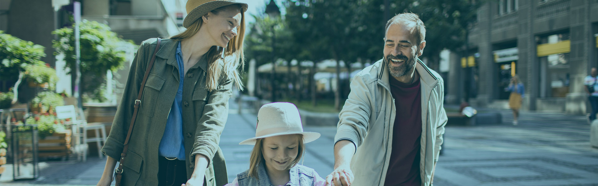 Checking Accounts Hero - Family walking around town