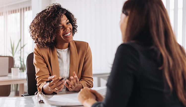 Two women in a business meeting.