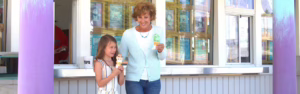 Financial Planning - Grandma and granddaughter eating ice cream