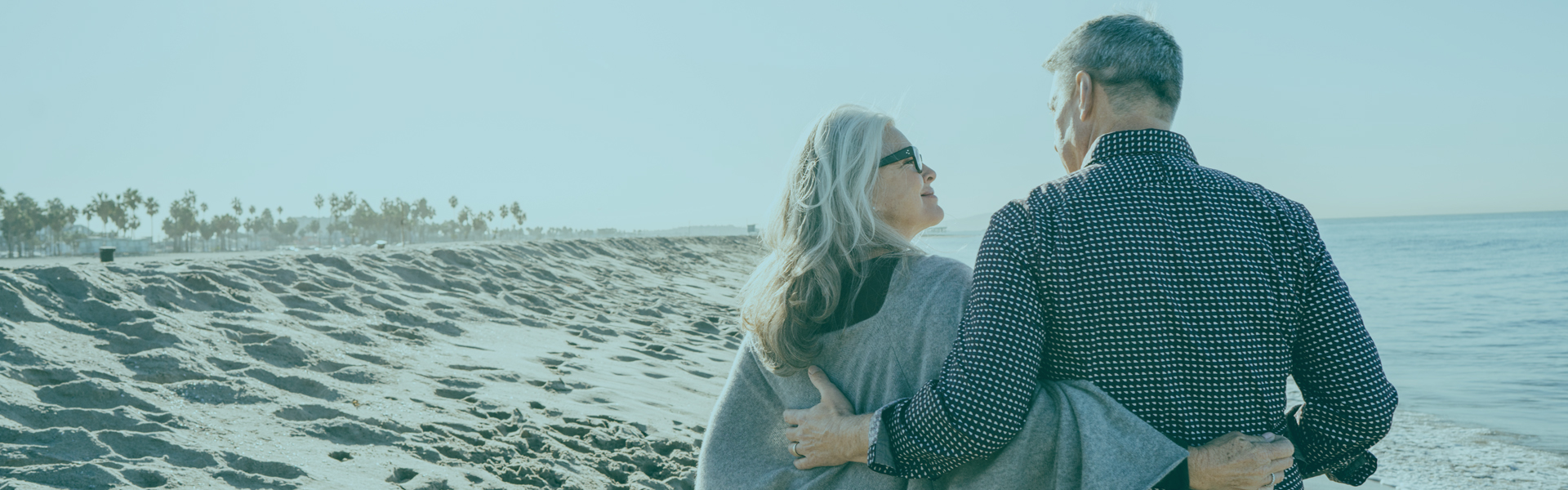 Money Market | Senior couple walking on beach