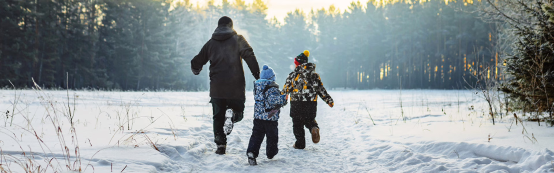 Family running in snow.