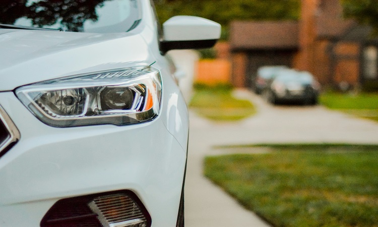 New white car in a driveway