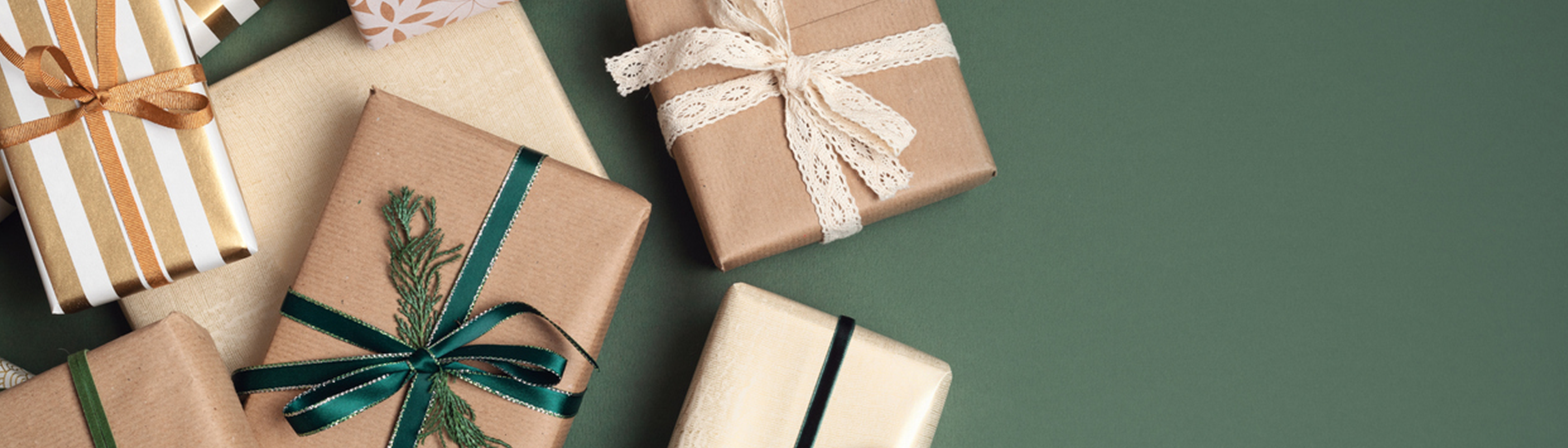 Variety of presents on dark green background.