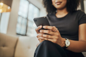 Woman holding a mobile phone using online banking