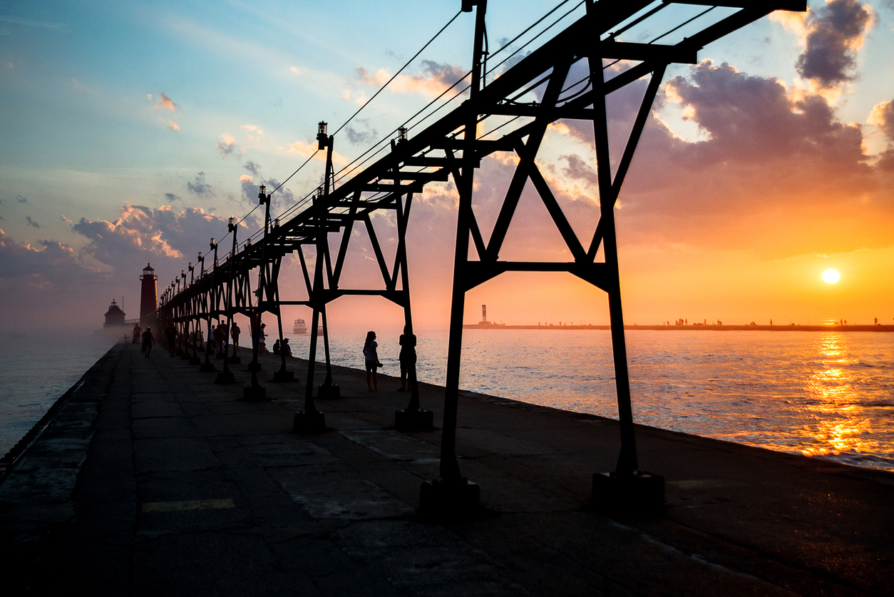 Grand Haven Lighthouse with sunset in the back in Grand Haven, Michigan